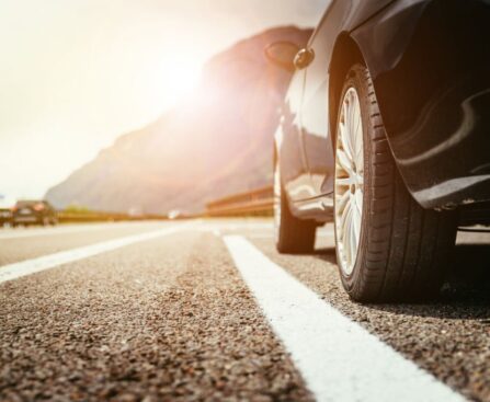Close up of a car standing on a breakdown lane, summer vacation